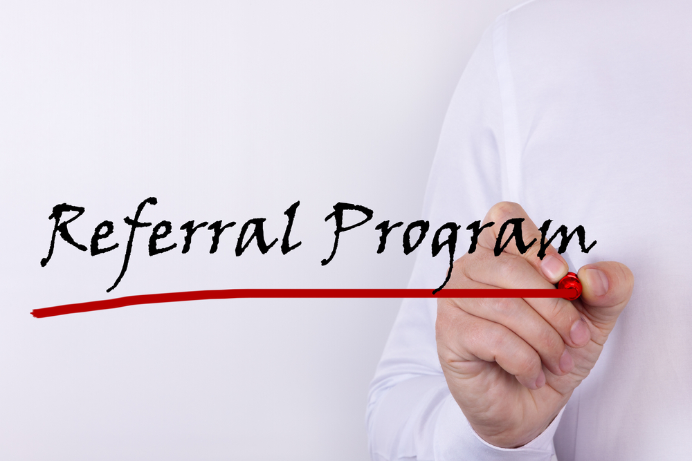 Hand,Writing,Inscription,Referral,Program,With,Marker,Concept