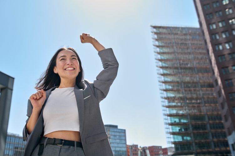 Young,Excited,Confident,Proud,Asian,Business,Woman,Winner,Wearing,Suit