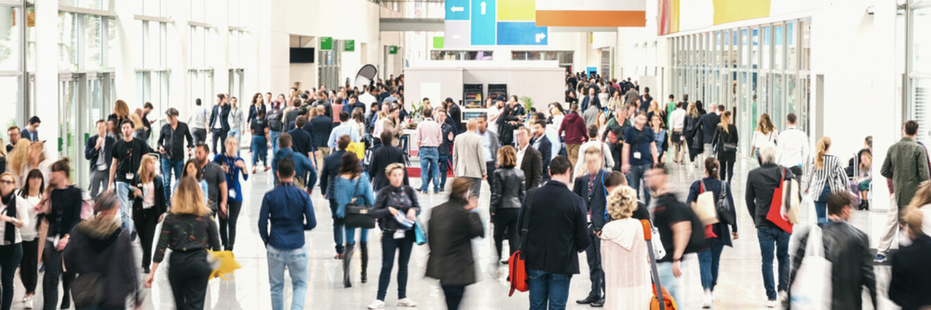 Large,Crowd,Of,Anonymous,Blurred,People,At,A,Trade,Fair Large,Crowd,Of,Anonymous,Blurred,People,At,A,Trade,Fair