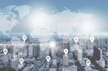 Searching,Location,On,Map,And,Pin,Above,Blue,Tone,City