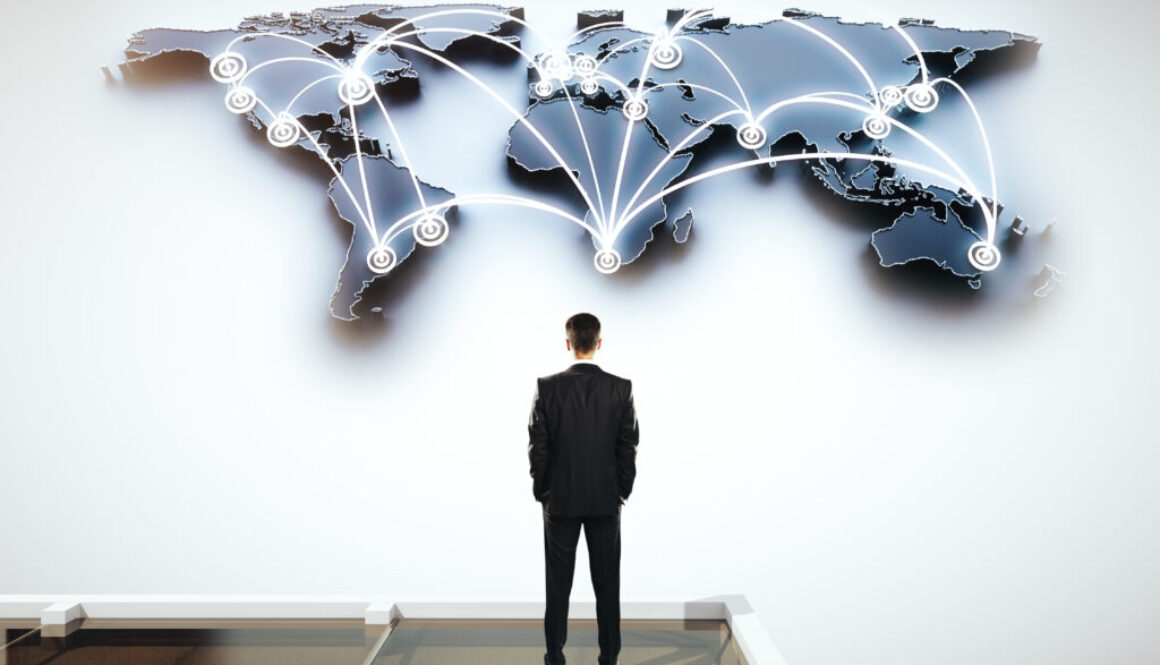 Global,Social,Networking,Concept,With,Businessman,Looking,At,Abstract,Map